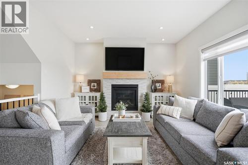 342 Stilling Manor, Saskatoon, SK - Indoor Photo Showing Living Room With Fireplace
