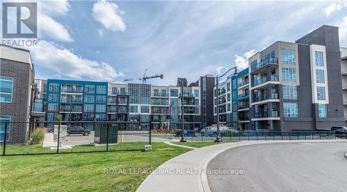 207 - 10 Concord Place, Grimsby (Grimsby Beach), ON - Outdoor With Balcony With Facade