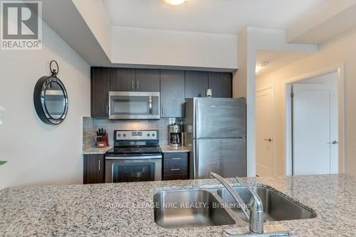 207 - 10 Concord Place, Grimsby (Grimsby Beach), ON - Indoor Photo Showing Kitchen With Stainless Steel Kitchen With Double Sink With Upgraded Kitchen