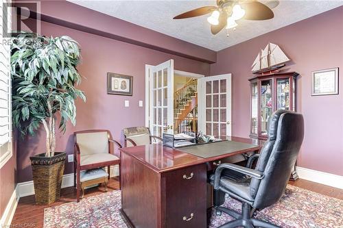 This room features rich hardwood flooring and a ceiling fan for comfort - 4278 Clubview Drive, Burlington, ON - Indoor Photo Showing Office