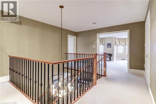 Upper level featuring carpeted flooring and an open doorway leading to an additional carpeted area with windows - 4278 Clubview Drive, Burlington, ON - Indoor Photo Showing Other Room