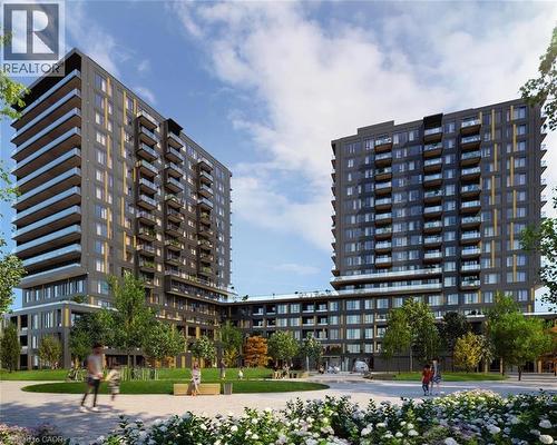 The property features a modern high-rise building with a dark facade, balconies with glass railings, and a landscaped green space with trees and flowering shrubs - 4878 Powers Common Unit# 224, Burlington, ON - Outdoor With Balcony With Facade