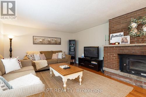 34 Staglir Drive, Tiny, ON - Indoor Photo Showing Living Room With Fireplace