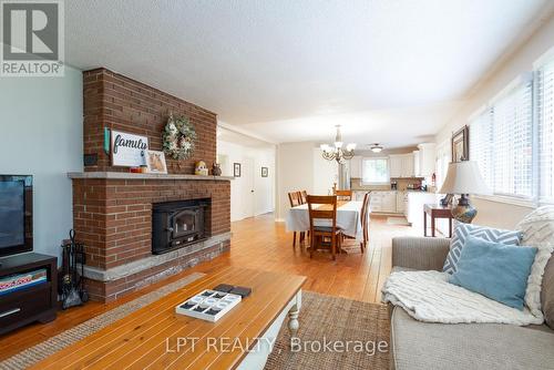 34 Staglir Drive, Tiny, ON - Indoor Photo Showing Living Room With Fireplace