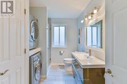 Main floor bathroom with laundry - 