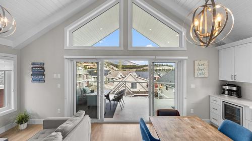 371-6727 Marbella Loop, Kelowna, BC - Indoor Photo Showing Dining Room With Fireplace