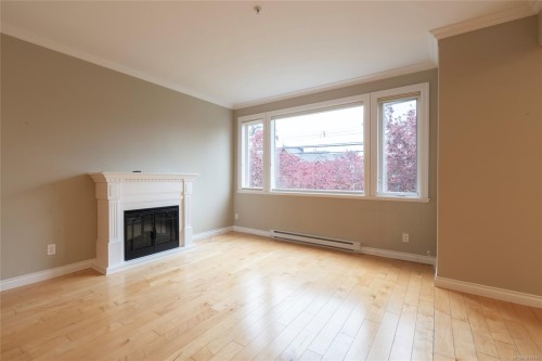 201-9942 Third St, Sidney, BC - Indoor Photo Showing Living Room With Fireplace