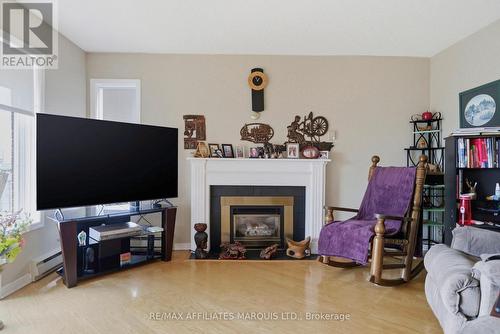 408 - 121 Water Street W, Cornwall, ON - Indoor Photo Showing Living Room With Fireplace