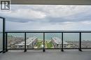 Expansive balcony with glass railing providing panoramic water views - 385 Winston Road Unit# 1607, Grimsby, ON  - Outdoor With Body Of Water With Balcony With View 