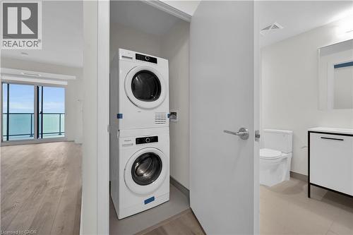 Insuite stackable laundry - 385 Winston Road Unit# 1607, Grimsby, ON - Indoor Photo Showing Laundry Room
