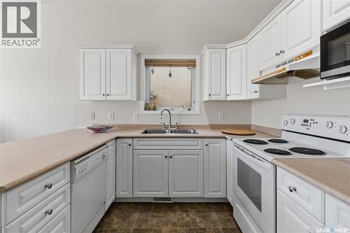 414 Adaskin Cove, Saskatoon, SK - Indoor Photo Showing Kitchen With Double Sink