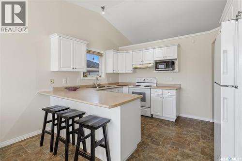 414 Adaskin Cove, Saskatoon, SK - Indoor Photo Showing Kitchen With Double Sink