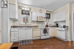Kitchen is large with access to laundry - 