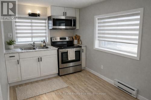 4 - 16 Huron Road, West Perth, ON - Indoor Photo Showing Kitchen With Stainless Steel Kitchen With Double Sink