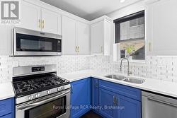 GAS STOVE & LOTS OF CABINETRY - 