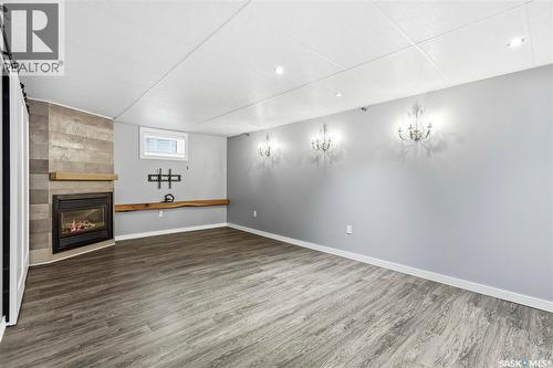 12 Secord Place, Regina, SK - Indoor Photo Showing Other Room With Fireplace