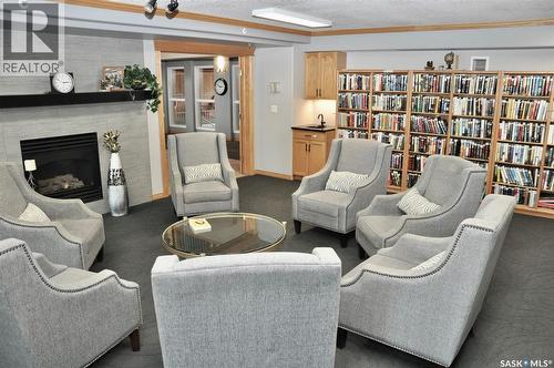 317 325 Keevil Crescent, Saskatoon, SK - Indoor Photo Showing Living Room With Fireplace