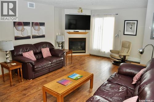 317 325 Keevil Crescent, Saskatoon, SK - Indoor Photo Showing Living Room With Fireplace