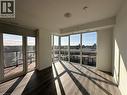 Bright and spacious room featuring large windows, a glass-paneled door leading to a balcony, and light-colored flooring - 108 Garment Street S Unit# 708, Kitchener, ON  - Indoor Photo Showing Other Room 