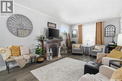 1150 3Rd Avenue Ne, Moose Jaw, SK - Indoor Photo Showing Living Room With Fireplace