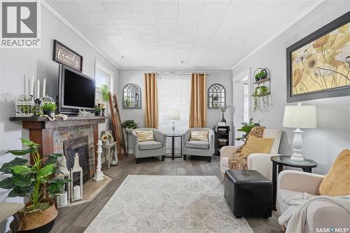 1150 3Rd Avenue Ne, Moose Jaw, SK - Indoor Photo Showing Living Room With Fireplace