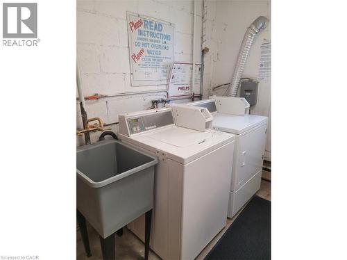 Dedicated laundry area with a utility sink, washing machine, and dryer - 981 Mohawk Road E, Hamilton, ON - Indoor Photo Showing Laundry Room
