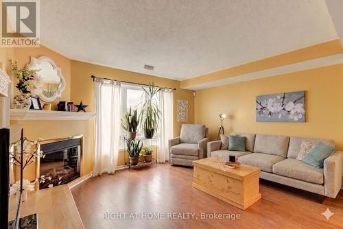 47 - 128 Bonfield Private, Ottawa, ON - Indoor Photo Showing Living Room With Fireplace