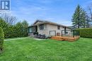 This photo has been AI altered to show green grass - 1969 Sharel Drive, Ottawa, ON  - Outdoor With Deck Patio Veranda 