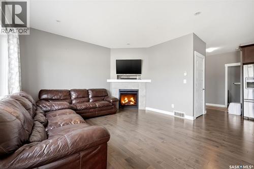 5517 Norseman Crescent, Regina, SK - Indoor Photo Showing Living Room With Fireplace