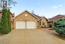 Concrete Driveway & Double Garage. - 1156 Augustus Drive, Burlington, ON  - Outdoor With Facade 