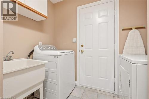Convenient Main Floor Laundry w/Garage Entry - 1156 Augustus Drive, Burlington, ON - Indoor Photo Showing Laundry Room