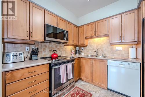 401 - 65 Bayberry Drive, Guelph (Village By The Arboretum), ON - Indoor Photo Showing Kitchen With Double Sink