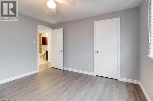 This room features light grey walls with white trim, light-colored flooring, and a ceiling fan - 687 Britannia Avenue, Hamilton, ON - Indoor Photo Showing Other Room