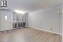 The entryway features a white paneled door with a decorative window, light-colored flooring, and light-toned walls - 687 Britannia Avenue, Hamilton, ON  - Indoor Photo Showing Other Room 