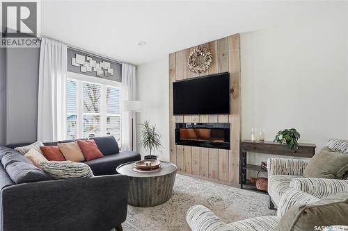 118 3Rd Street E, Saskatoon, SK - Indoor Photo Showing Living Room With Fireplace
