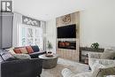 118 3Rd Street E, Saskatoon, SK  - Indoor Photo Showing Living Room With Fireplace 