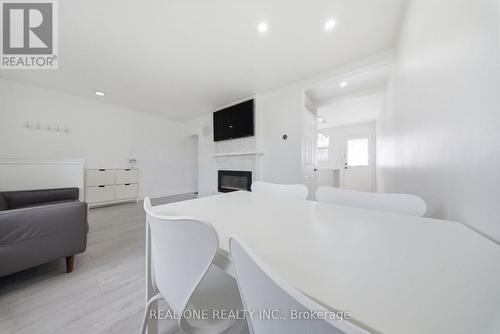 24 Sumach Street, Hamilton, ON - Indoor Photo Showing Other Room With Fireplace