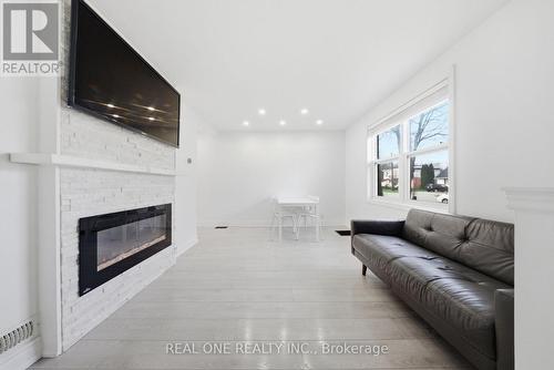 24 Sumach Street, Hamilton, ON - Indoor Photo Showing Living Room With Fireplace