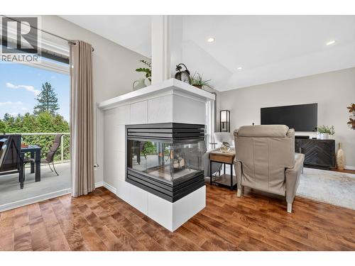 3925 Gallaghers Circle, Kelowna, BC - Indoor Photo Showing Living Room With Fireplace