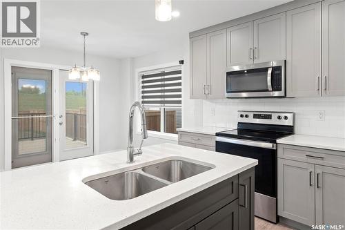 304 Pepper Place, Saskatoon, SK - Indoor Photo Showing Kitchen With Double Sink