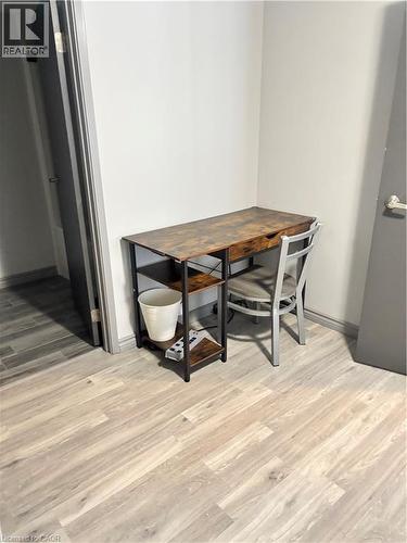 The room features light-toned wood-look flooring and light-colored walls, creating a bright atmosphere - 275 Larch Street Unit# 108, Waterloo, ON - Indoor Photo Showing Dining Room