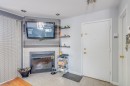 Hall d'entrée/Vestibule - 202-68 Rue Pierre-Laporte, Saint-Eustache, QC  - Indoor Photo Showing Other Room With Fireplace 