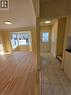 The property features hardwood floors and a bay window in the main living area, complemented by a tiled entryway with a decorative glass front door - 62 Richwill Road Unit# Upper, Hamilton, ON  - Indoor Photo Showing Other Room 