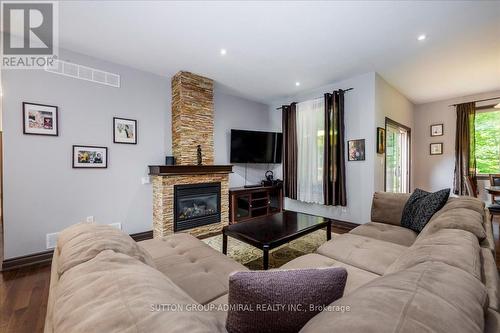 79 Forest Circle, Tiny, ON - Indoor Photo Showing Living Room With Fireplace