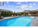 Kidney shaped pool - 2015 Valleyview Drive, Kamloops, BC  - Outdoor With In Ground Pool With Backyard 