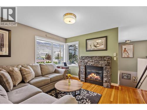 Hardwood floors - 2015 Valleyview Drive, Kamloops, BC - Indoor Photo Showing Living Room With Fireplace