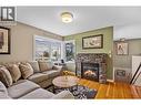 Hardwood floors - 2015 Valleyview Drive, Kamloops, BC  - Indoor Photo Showing Living Room With Fireplace 