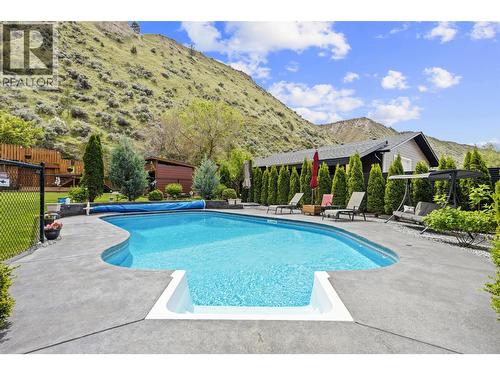 Kidney shaped inground pool installed 2017 - 2015 Valleyview Drive, Kamloops, BC - Outdoor With In Ground Pool With Deck Patio Veranda With Backyard