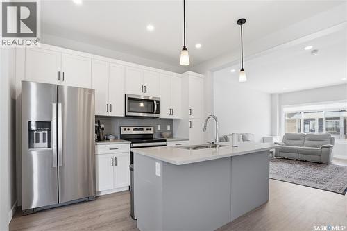 1047 Brighton Gate, Saskatoon, SK - Indoor Photo Showing Kitchen With Stainless Steel Kitchen With Double Sink With Upgraded Kitchen