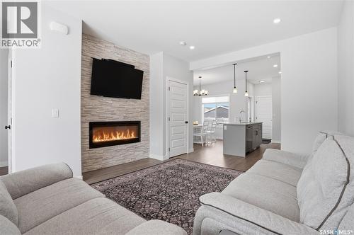 1047 Brighton Gate, Saskatoon, SK - Indoor Photo Showing Living Room With Fireplace